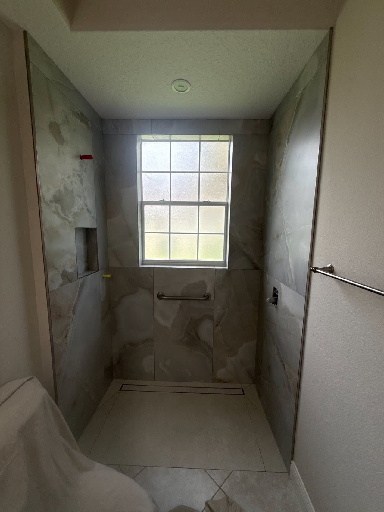 Marble-Look Shower · Window Wall